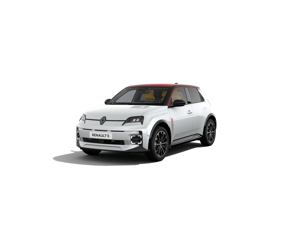 Renault 5 im Vordergrund, weiße Karosserie mit roten Akzenten, moderne Interpretation des klassischen Designs.