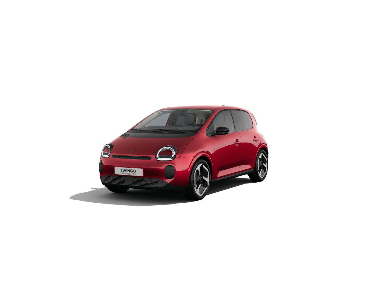 Ein roter Renault Twingo, sportliches Design, moderne Frontscheinwerfer, fotografiert aus einem schrägen Winkel.