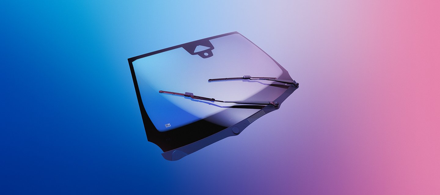 Frontscheibe mit Wischern vor einem farbverlaufenden blau-rosa Hintergrund.