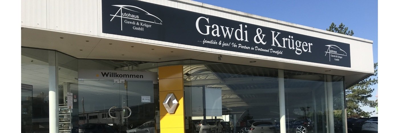 Autohaus Gawdi & Krüger mit Willkommensschild und Renault-Logo an der Fassade.
